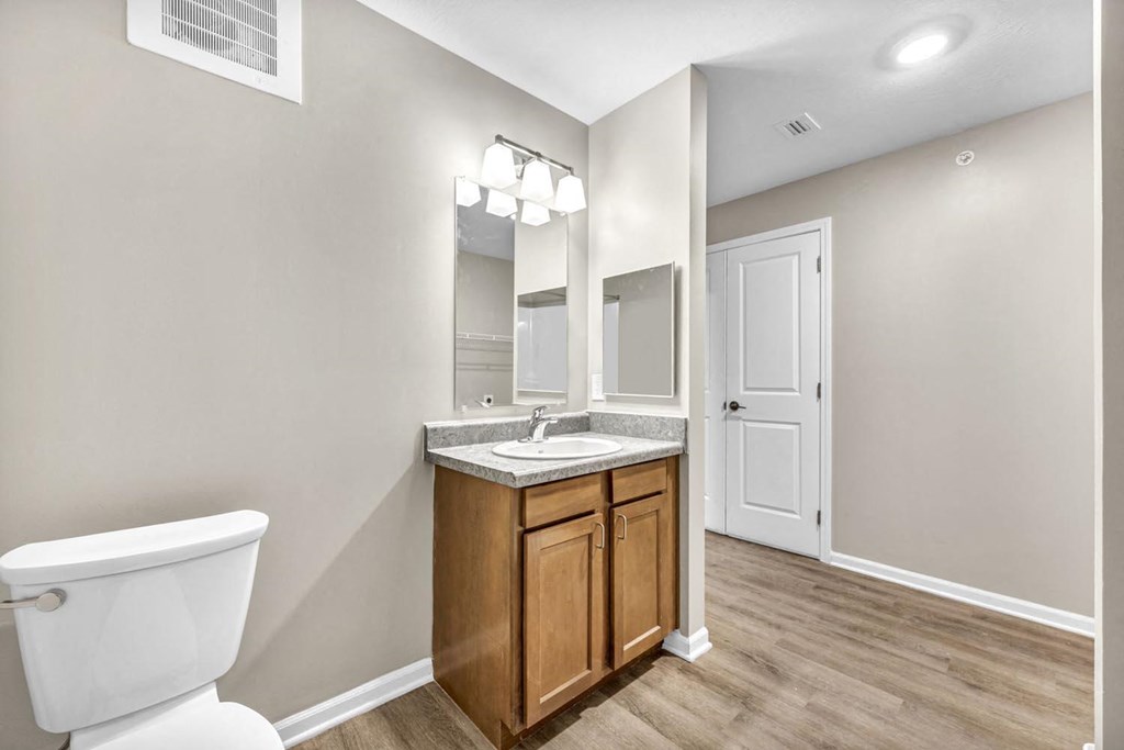 an empty bathroom with a toilet and a sink