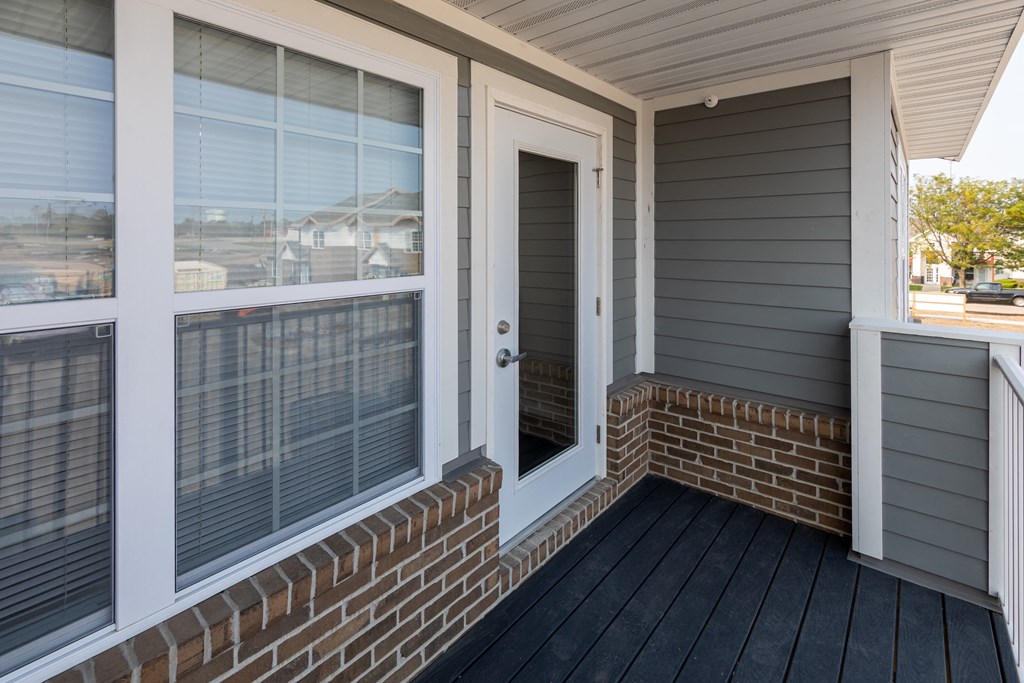 the front porch of a house with a door