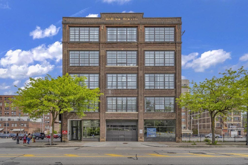a large brick building with a large garage door in front of it