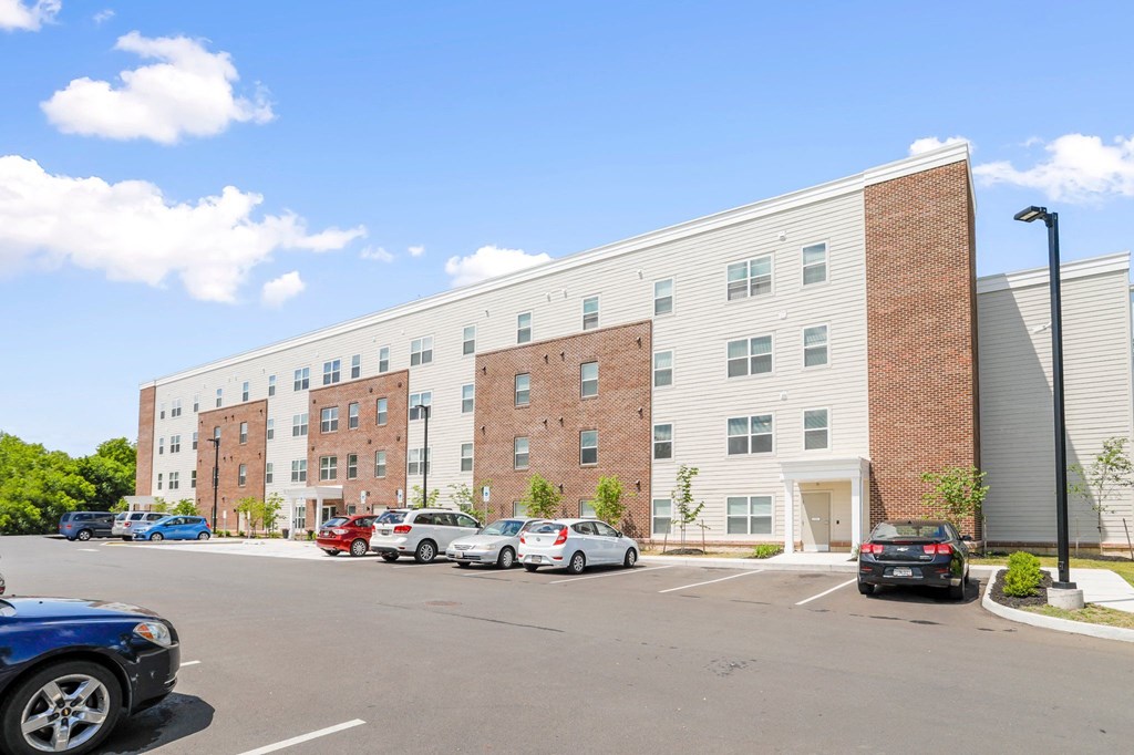 a large building with a parking lot in front of it