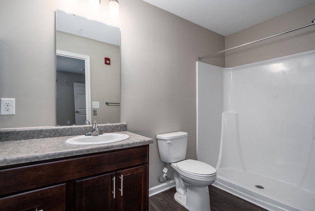 a bathroom with a sink toilet and a shower
