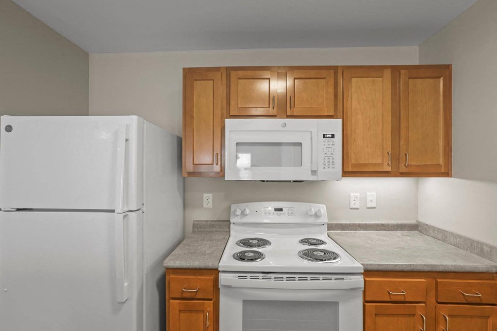 a kitchen with a stove microwave and refrigerator