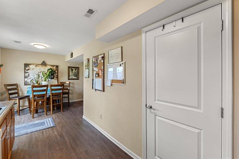 a kitchen and dining room with a large white door