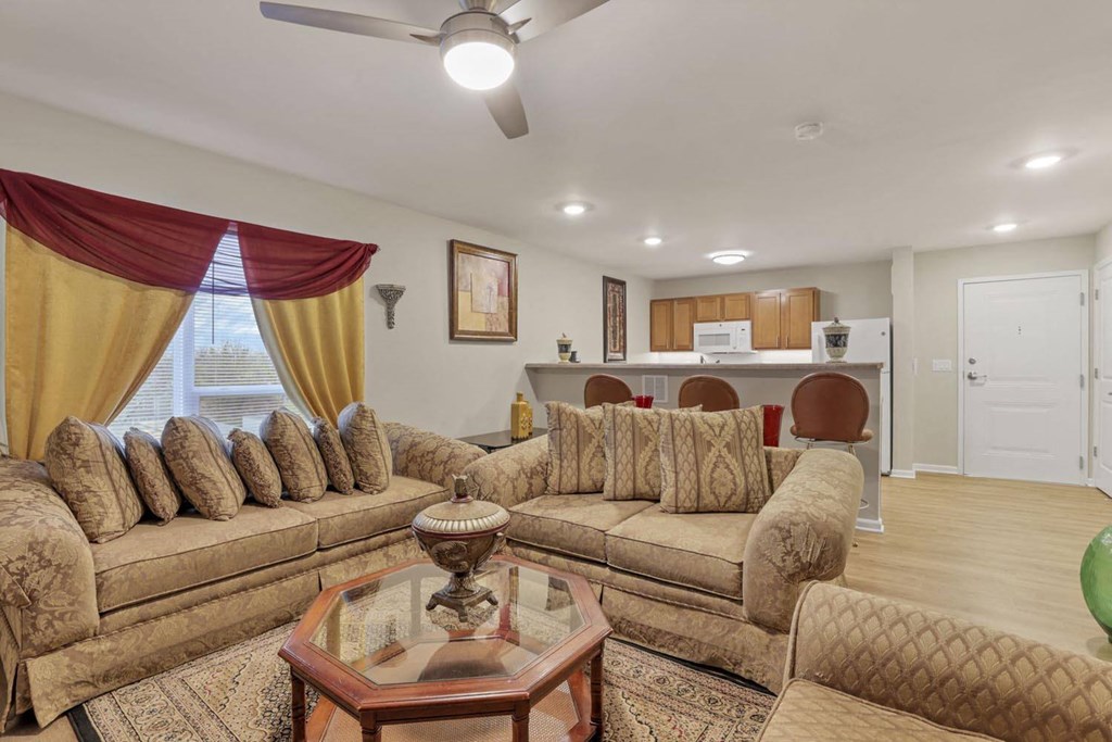 a living room with couches and a table