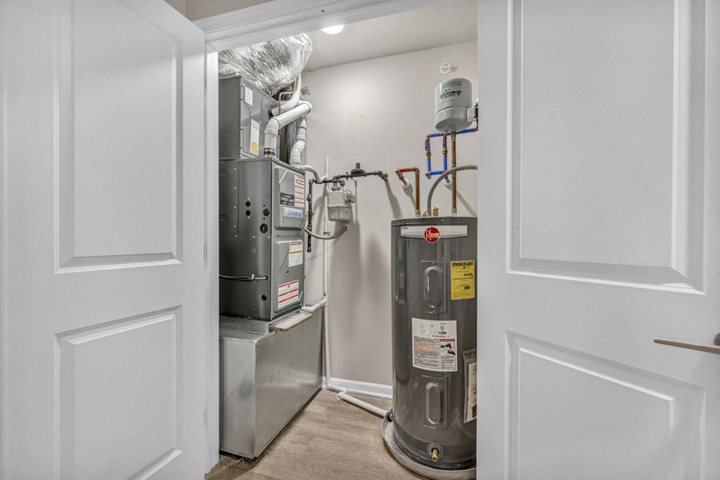 a room with a heating and cooling system and a door