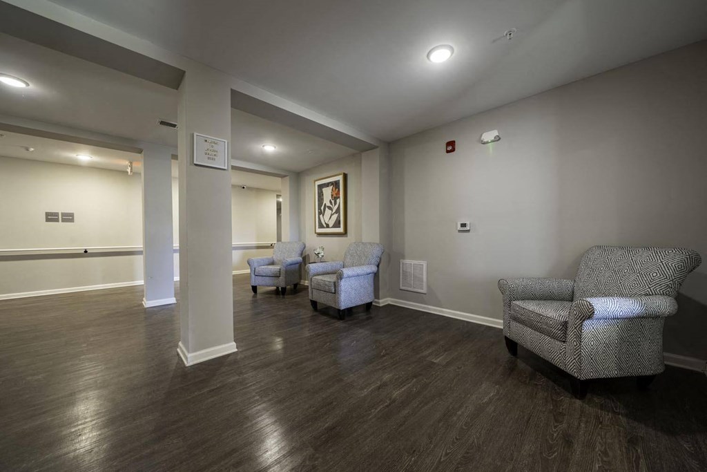 a living room with couches and chairs