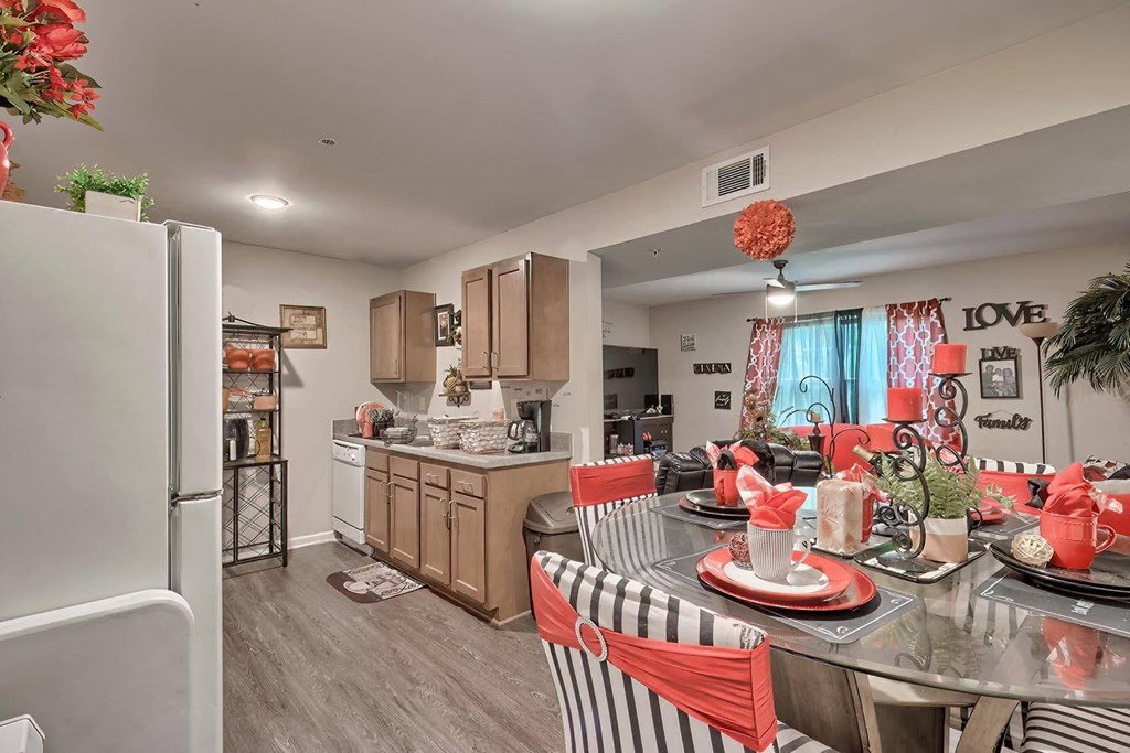 a kitchen and dining room with a table and chairs