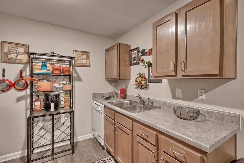 a kitchen with wooden cabinets and a sink