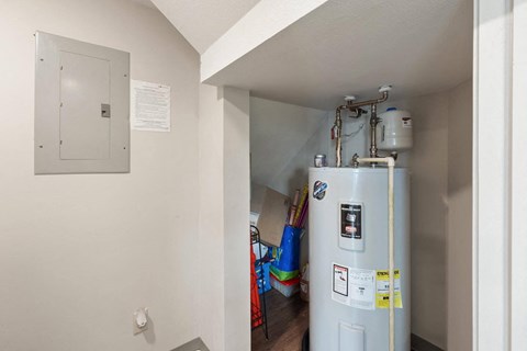 a refrigerator in the corner of a room with a door