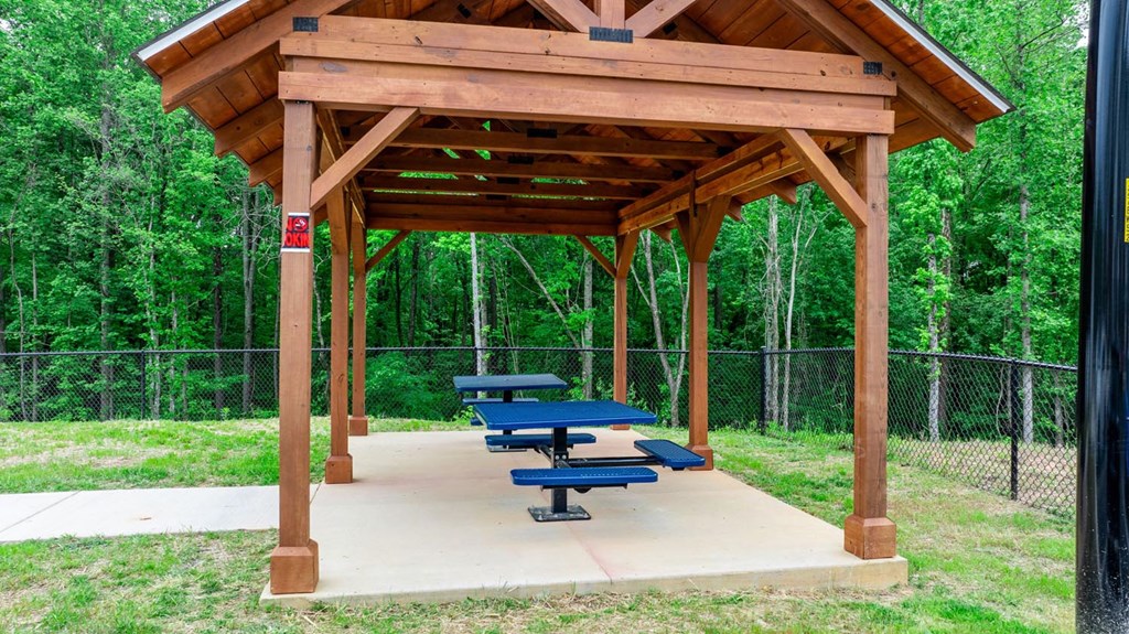 a picnic area with benches and a pavilion