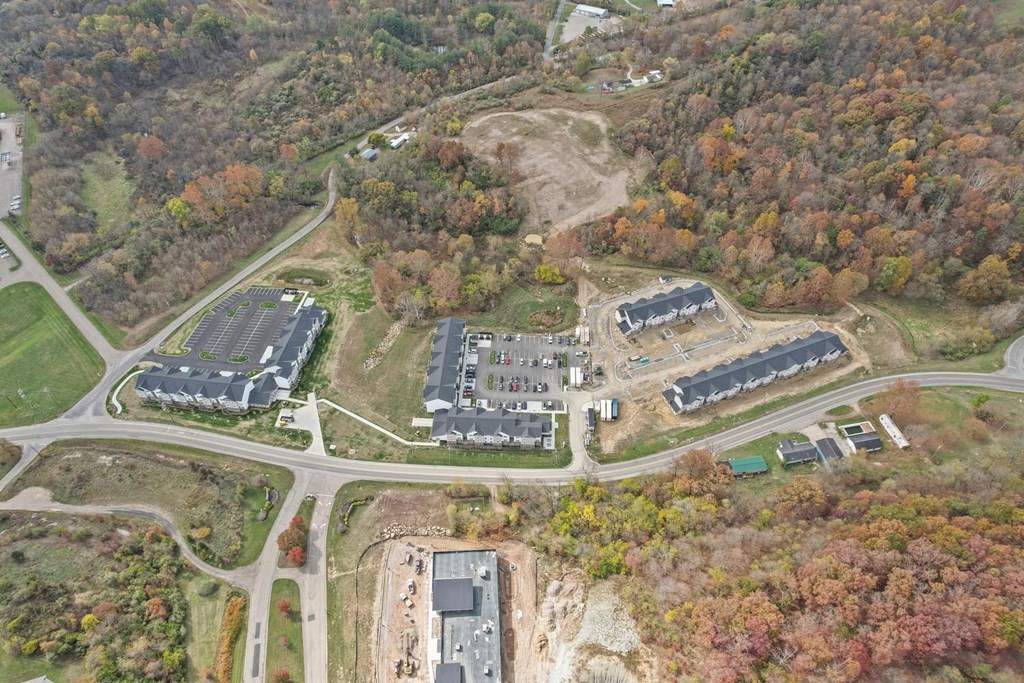 an aerial view of several buildings and a road