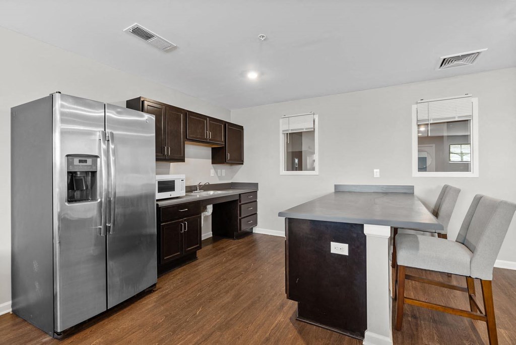 a kitchen and dining area in a 555 waverly unit