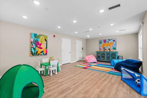 A room with a green tent and a blue tent.