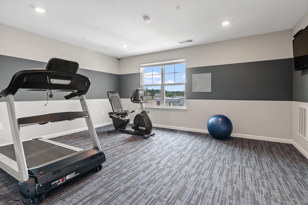 the retreat at thousand oaks fitness room with treadmill and exercise balls