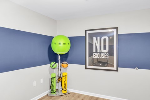 A room with a blue wall and a picture frame with the word "NO" on it.