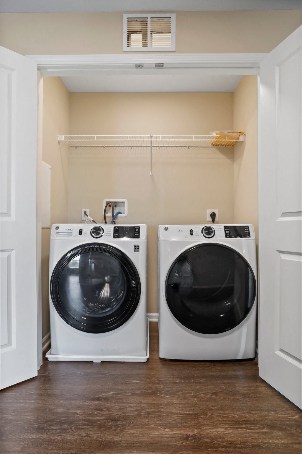 a small laundry room with a washer and dryer