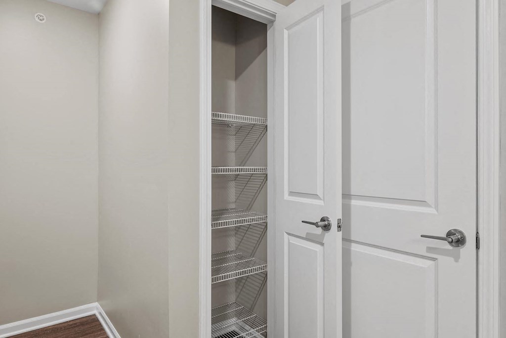 A white door with a glass panel is open.