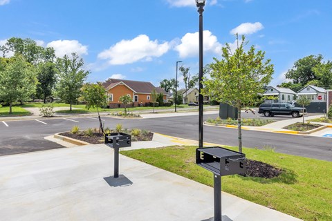 A black mailbox is on the left and a black mailbox with a red label is on the right.