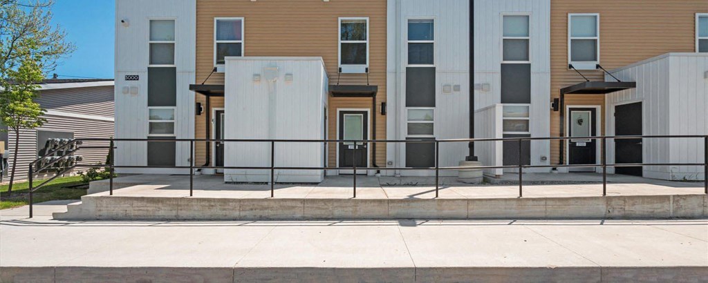 a building with a fence in front of it