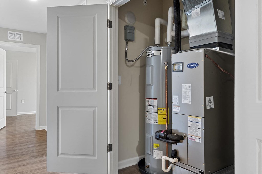 a gas furnace in a room next to a door