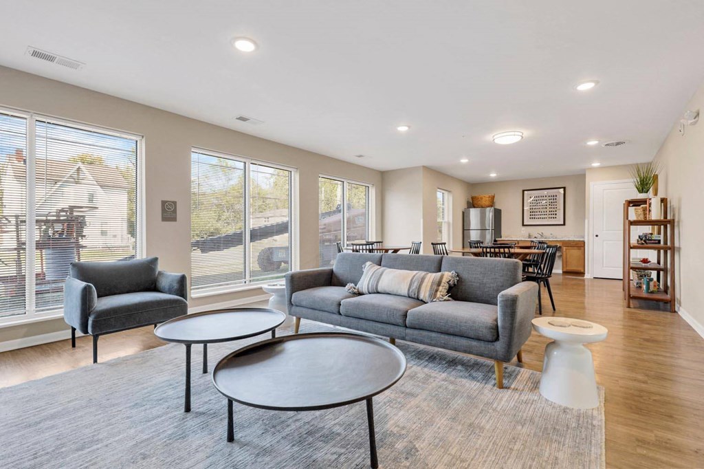 a living room with a couch and tables