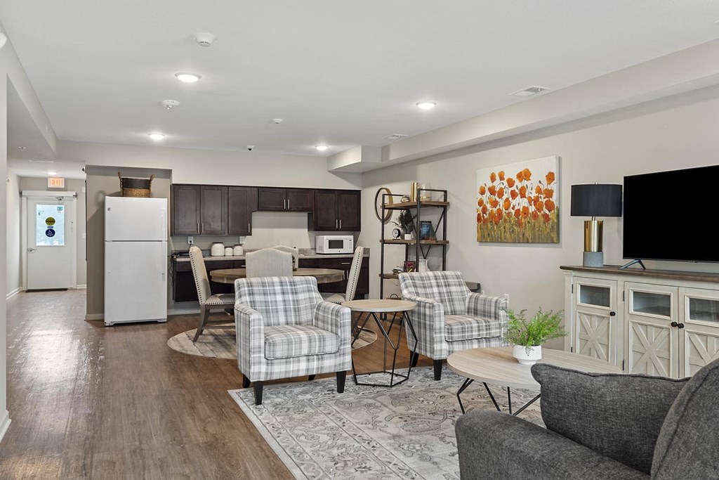 a living room with a kitchen and a dining room