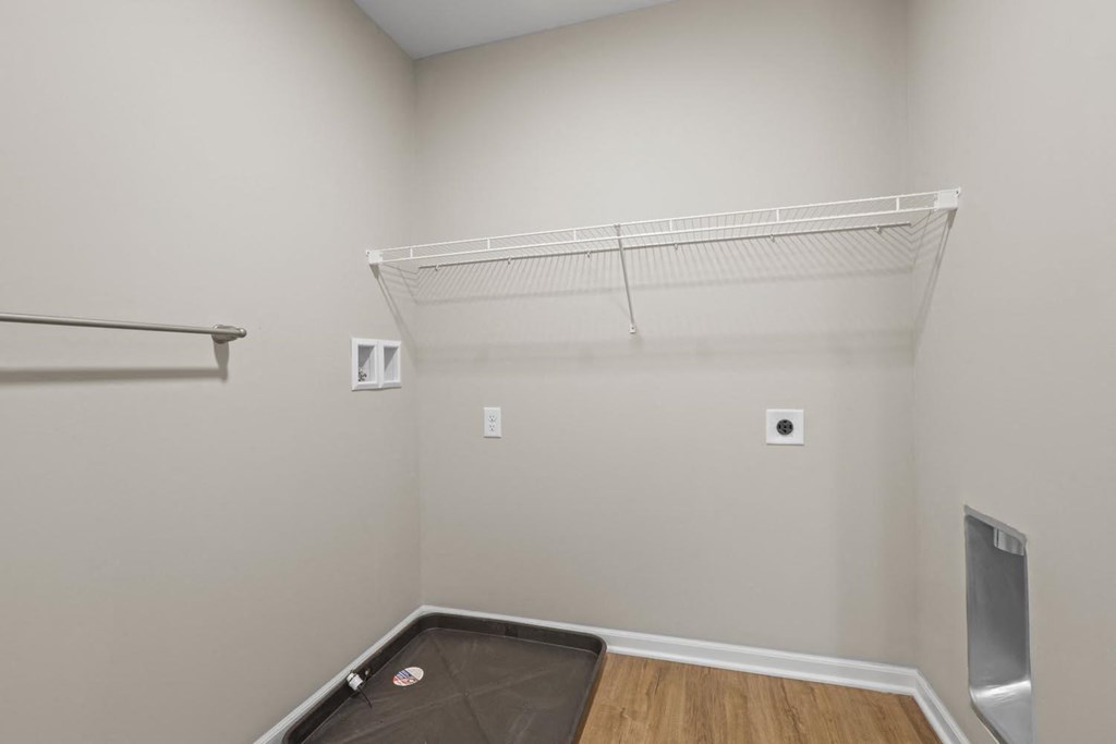 a room with a closet and a mirror on the wall