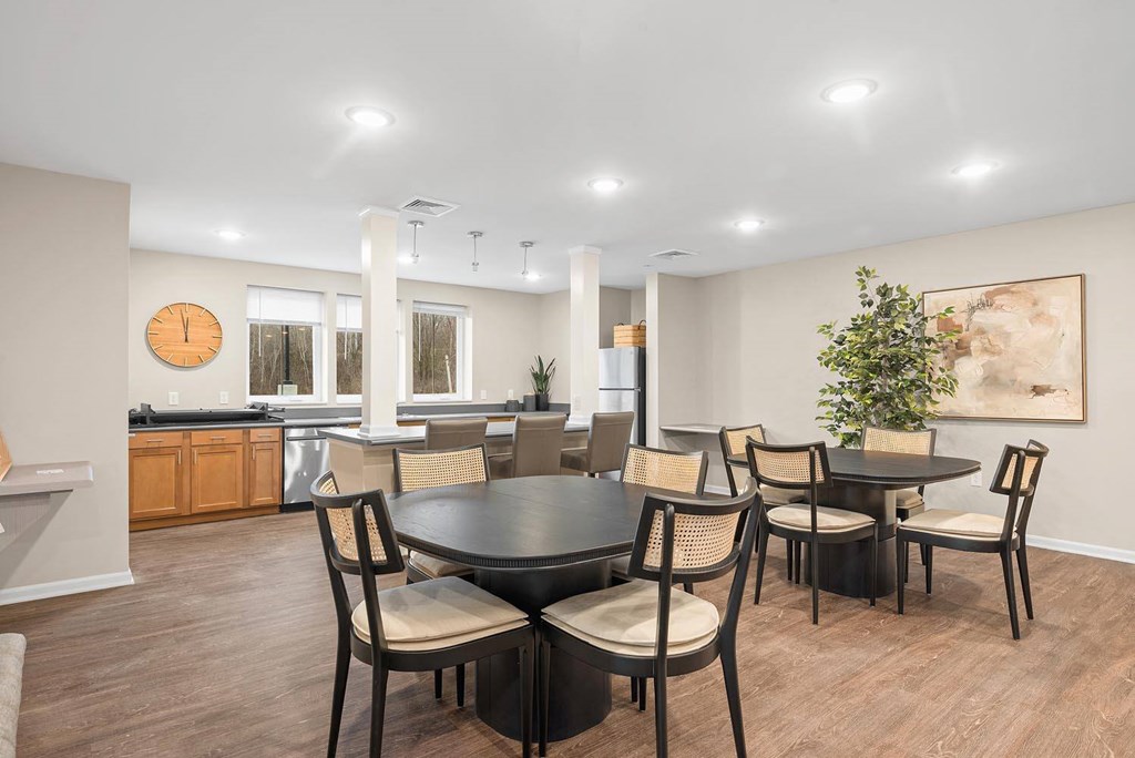 A dining room with a table set for six.