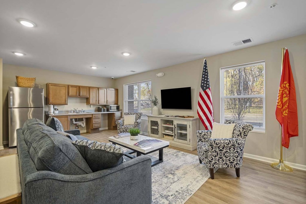 a living room and kitchen with an flag