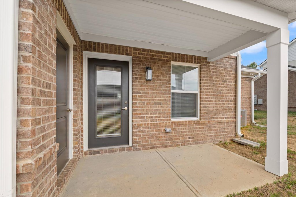 A house with a grey door and a window.