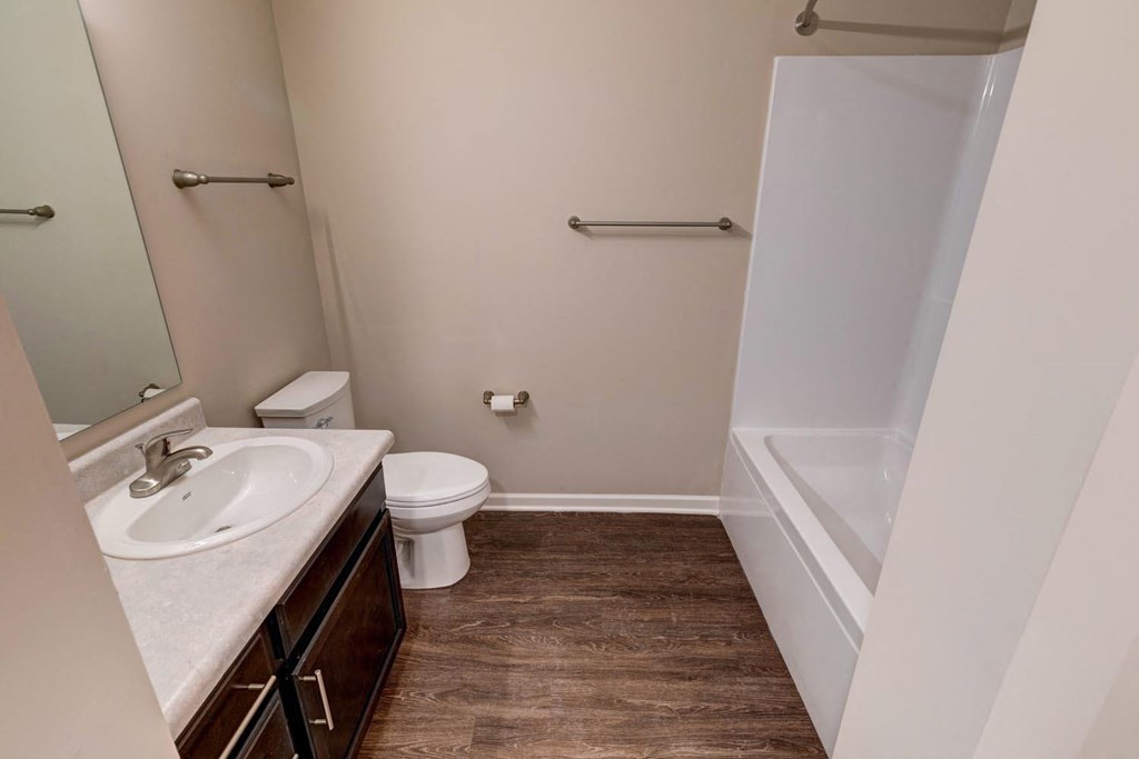 a bathroom with a toilet sink and bathtub