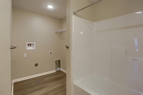A bathroom with a walk-in shower and a toilet.