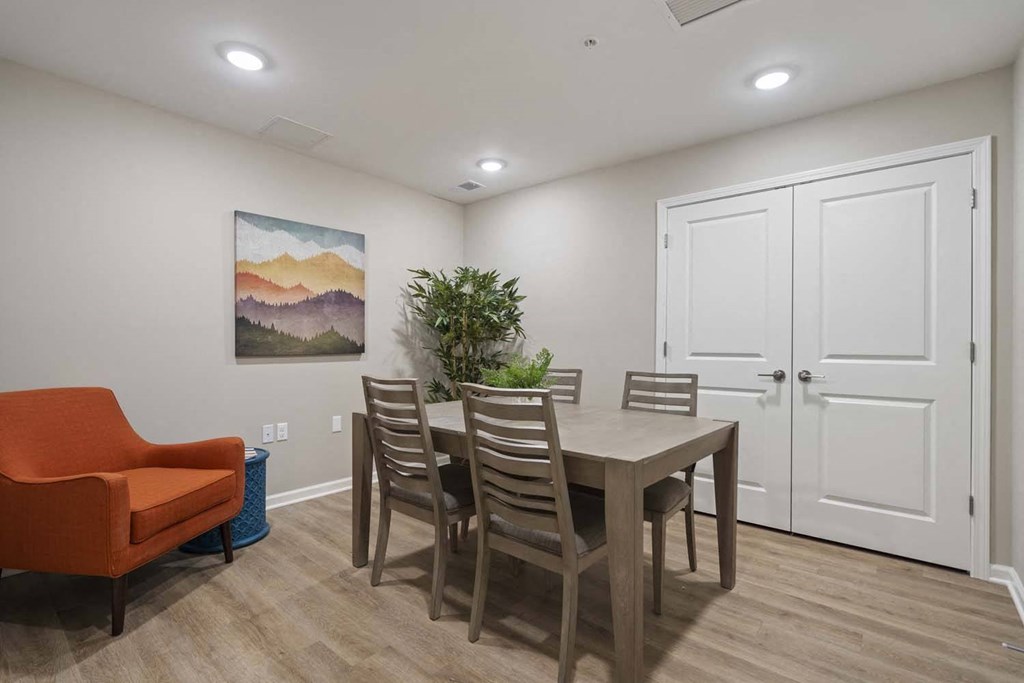 a dining room with a table and chairs