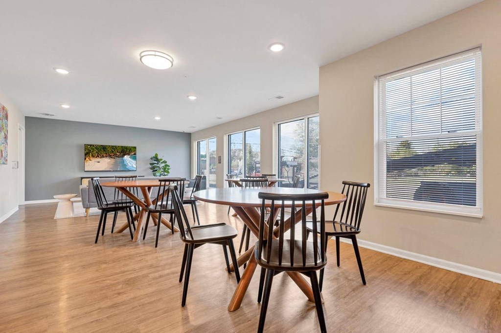 a dining room with a table and chairs