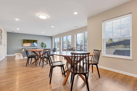 a dining room with a table and chairs