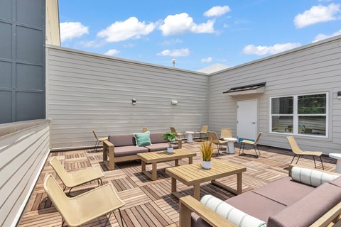 A sunny day in a backyard with a patio set.