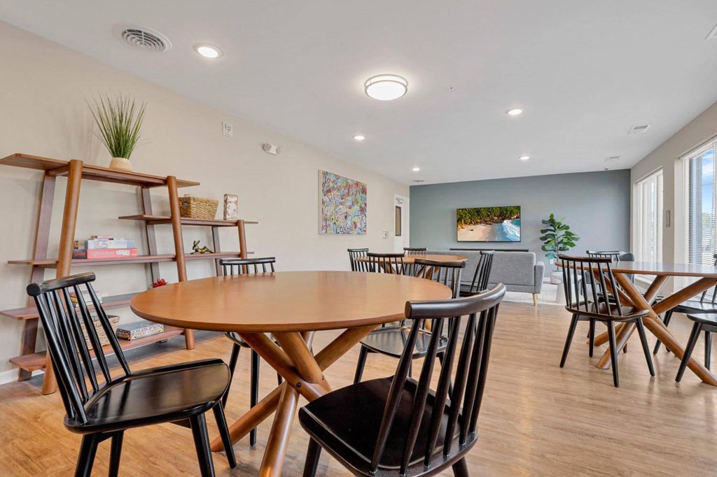 a dining room with a table and chairs