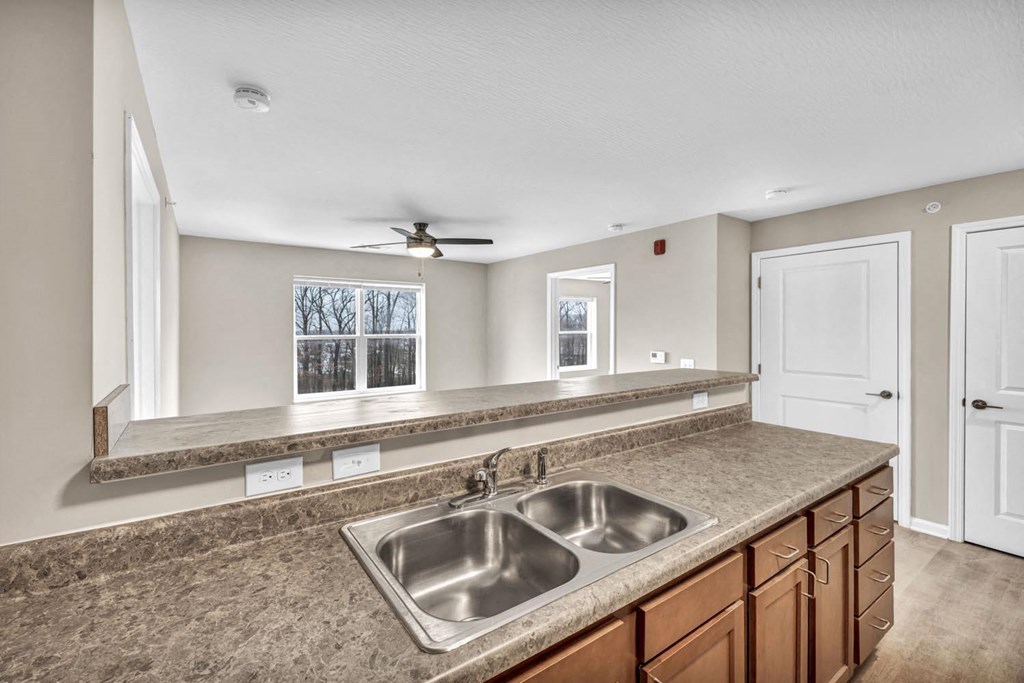 a kitchen with a sink and a counter top