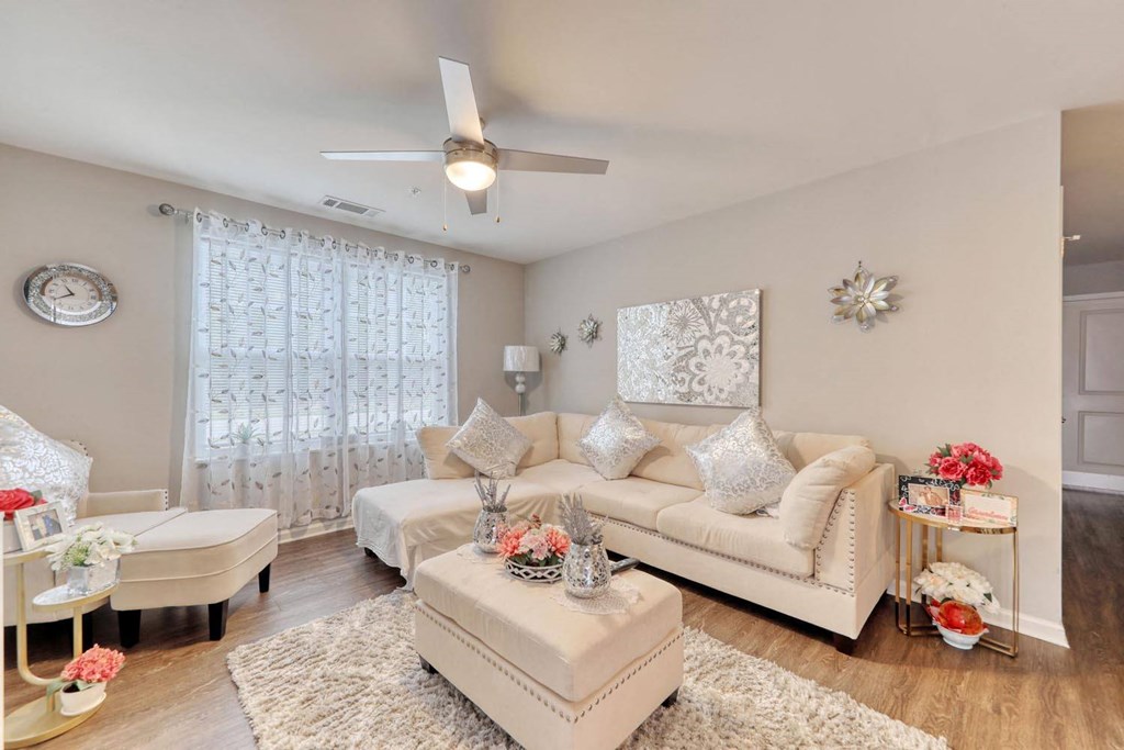 a living room with a couch and a chair