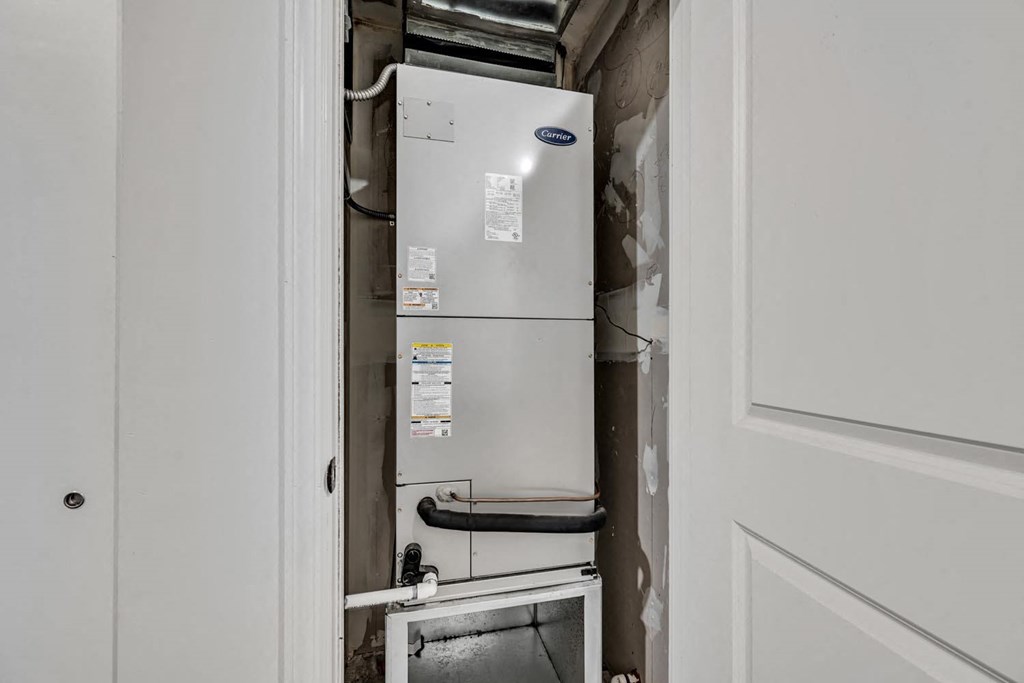 a white refrigerator freezer sitting next to a doorway