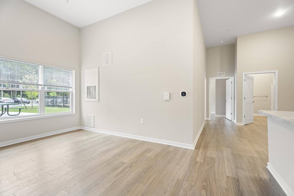 A room with a window and a door.