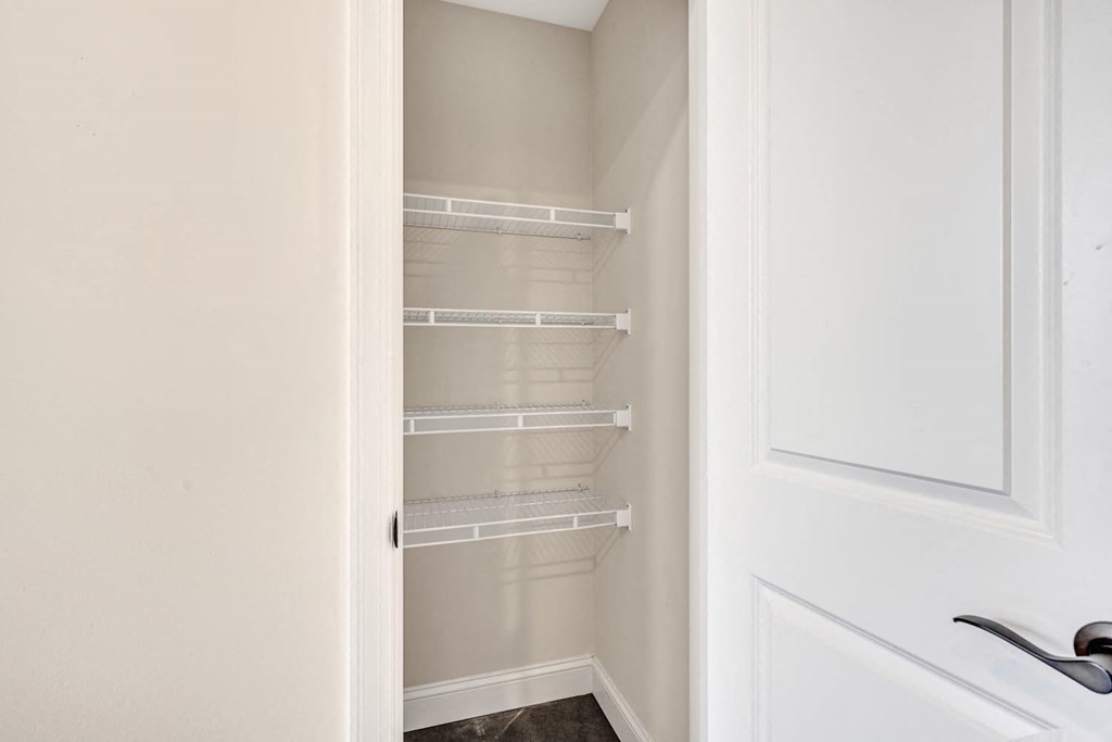 a walk in closet in a 555 waverly unit