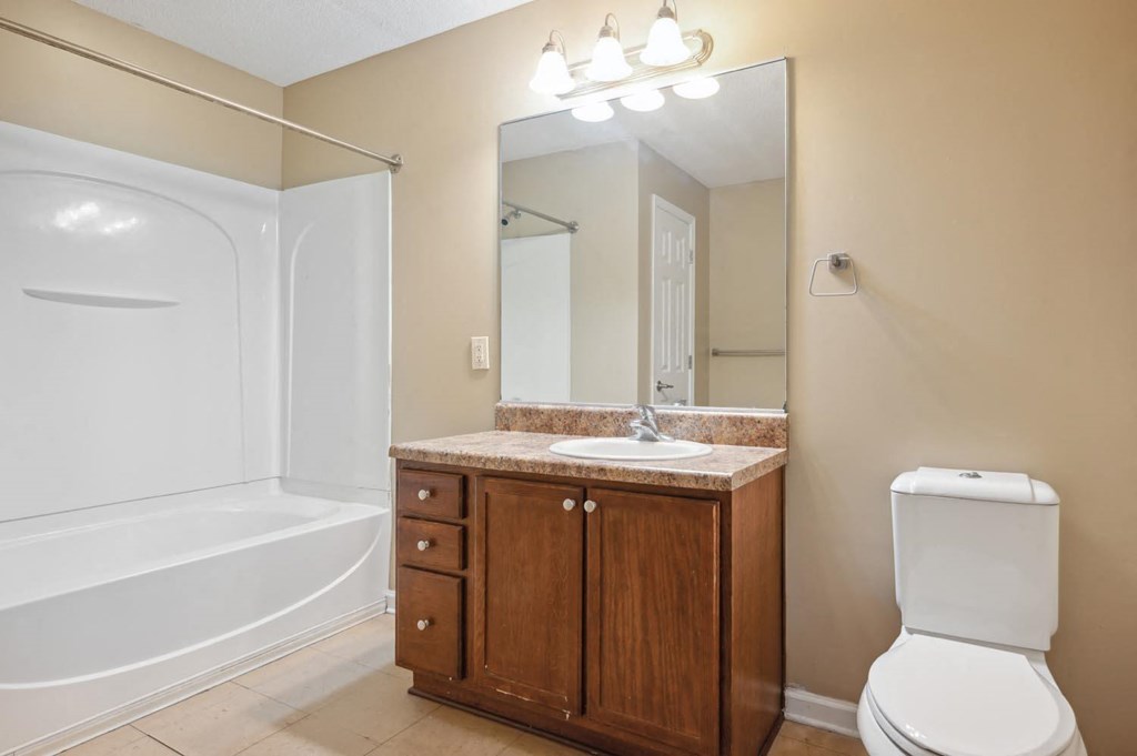 a bathroom with a sink toilet and a shower