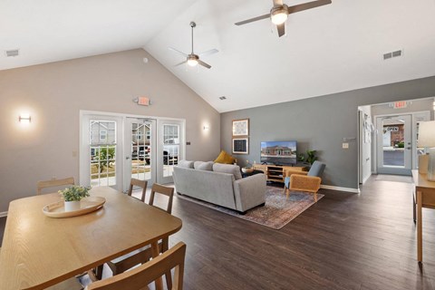 a living room and dining room with a couch and a table