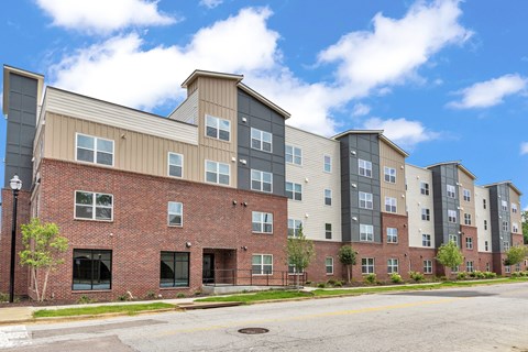 A large apartment complex with multiple buildings and balconies.