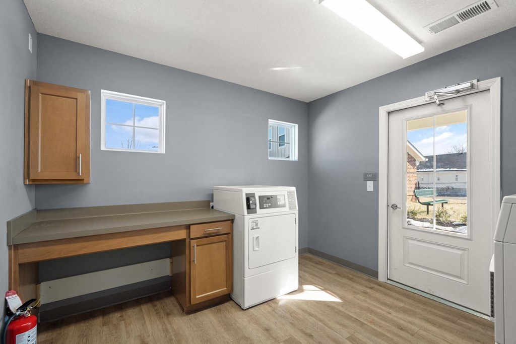 A laundry room with a washer and dryer.
