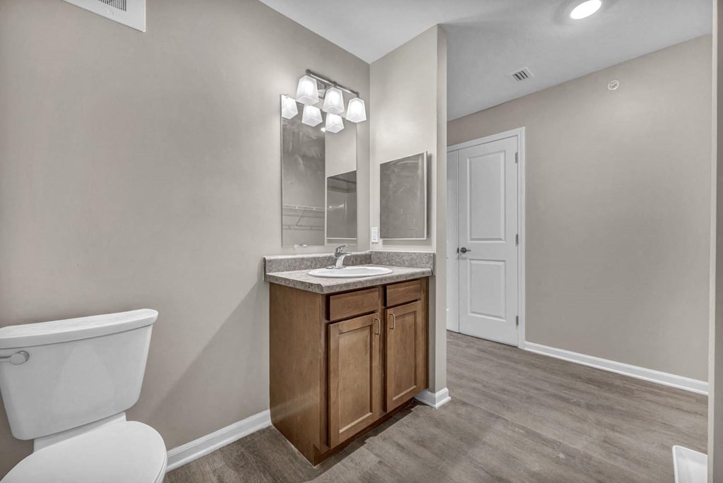 an empty bathroom with a toilet and a sink