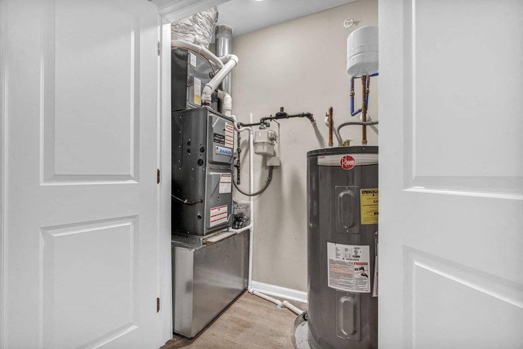 a room with a heater and a refrigerator in it