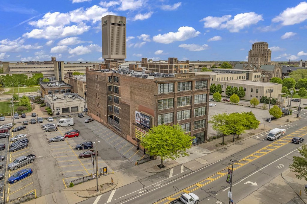 an aerial view of a brick building in the middle of a city