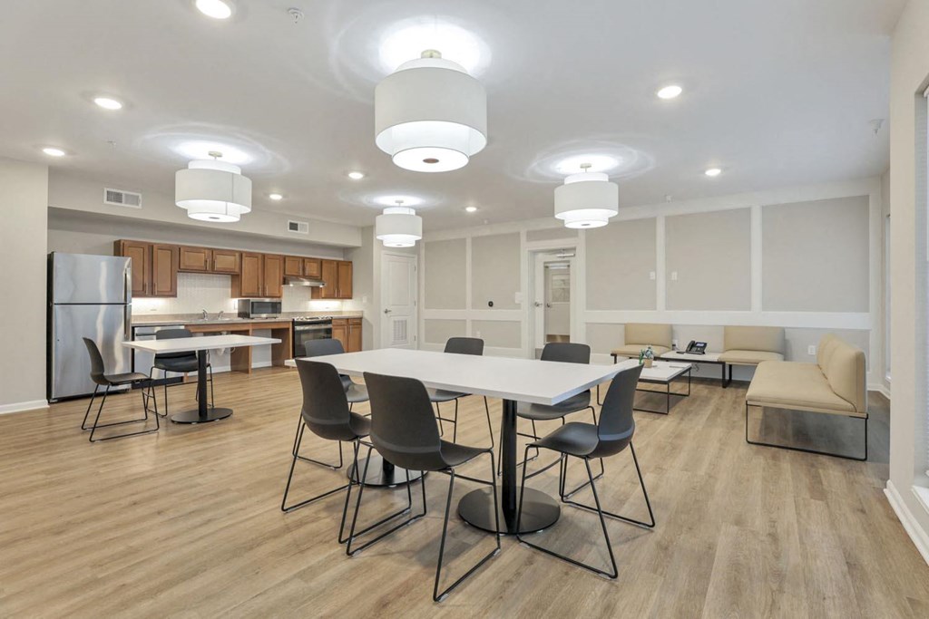 a dining room with a table and chairs